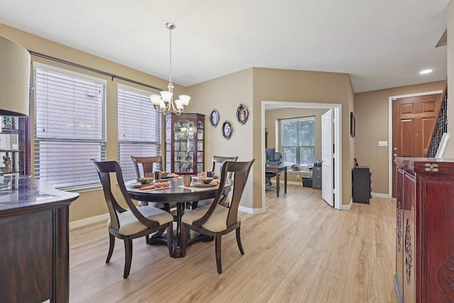 1124 Calla Lily Blvd, Leander, TX 78641 - dining space featuring light wood-type flooring and a chandelier