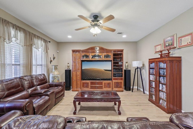 1124 Calla Lily Blvd, Leander, TX 78641 - living room with wood finished floors, a ceiling fan, and recessed lighting