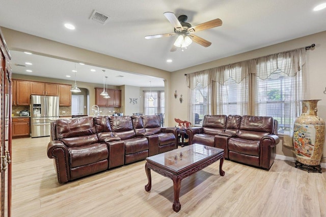 1124 Calla Lily Blvd, Leander, TX 78641 - living area featuring light wood-style flooring, a ceiling fan, and recessed lighting