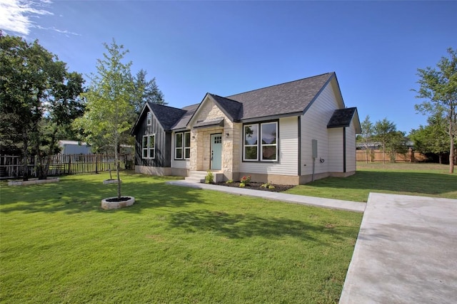 109 Creek Side Dr, Bastrop, TX 78602 - view of front of home with stone siding and a shingled roof