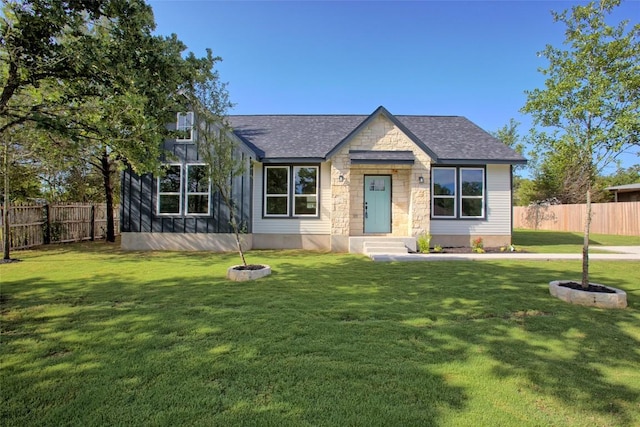 109 Creek Side Dr, Bastrop, TX 78602 - view of front of property with stone siding and a shingled roof