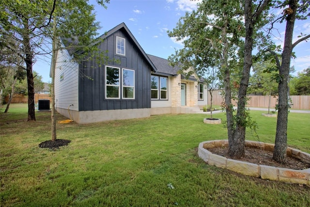 109 Creek Side Dr, Bastrop, TX 78602 - rear view of property with board and batten siding