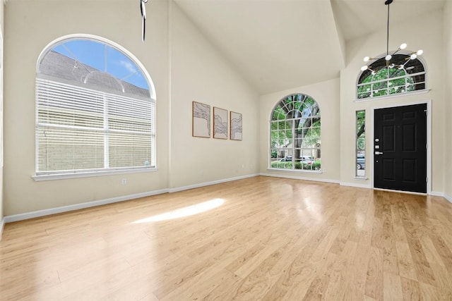 3528 Ruby Red Dr, Austin, TX 78728 - foyer with high vaulted ceiling and wood finished floors