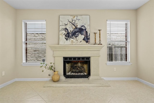3528 Ruby Red Dr, Austin, TX 78728 - unfurnished living room featuring tile patterned floors, a fireplace with raised hearth, and plenty of natural light