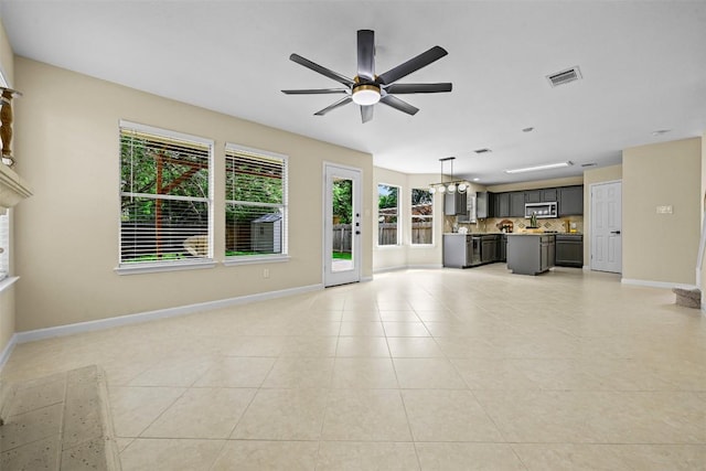 3528 Ruby Red Dr, Austin, TX 78728 - unfurnished living room with ceiling fan and light tile patterned floors