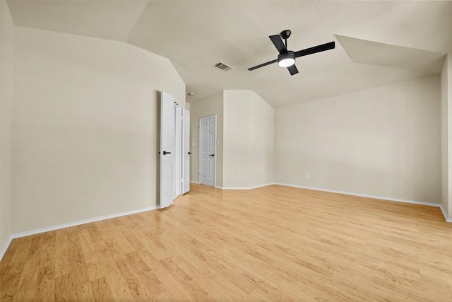 3528 Ruby Red Dr, Austin, TX 78728 - unfurnished room with vaulted ceiling, light wood finished floors, and a ceiling fan