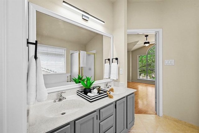 3528 Ruby Red Dr, Austin, TX 78728 - bathroom with double vanity, a shower stall, a ceiling fan, and tile patterned floors