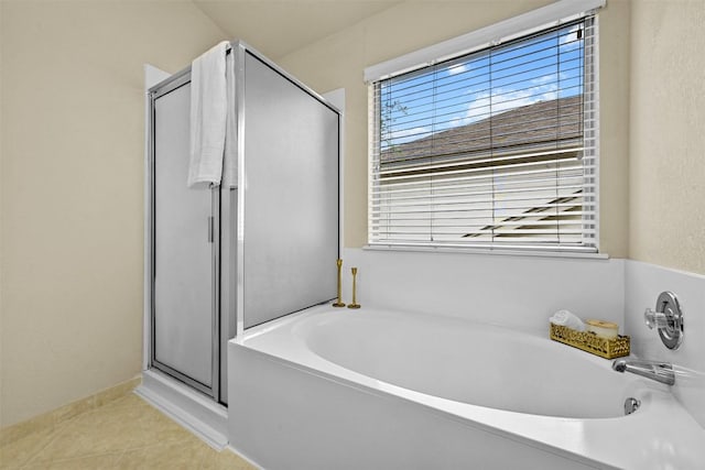 3528 Ruby Red Dr, Austin, TX 78728 - bathroom featuring a shower stall, a garden tub, and tile patterned floors