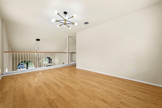 3528 Ruby Red Dr, Austin, TX 78728 - spare room featuring a chandelier and wood finished floors