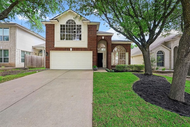 3528 Ruby Red Dr, Austin, TX 78728 - traditional-style house with an attached garage, driveway, and brick siding