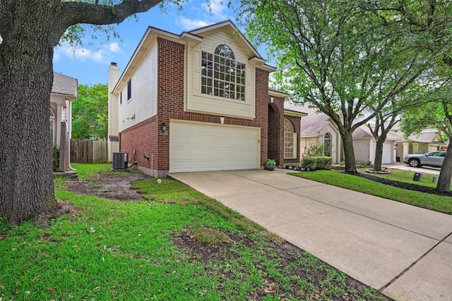 3528 Ruby Red Dr, Austin, TX 78728 - view of front of home with brick siding, an attached garage, and driveway