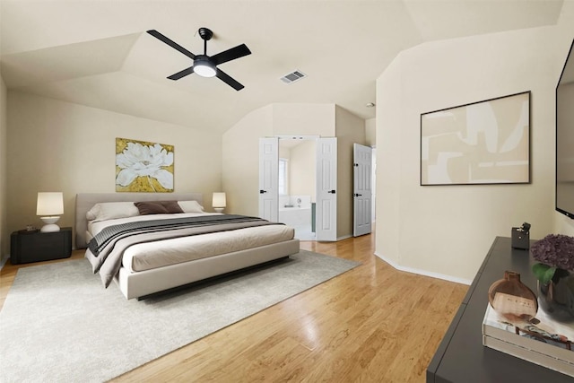 3528 Ruby Red Dr, Austin, TX 78728 - bedroom featuring light wood-style floors, lofted ceiling, a ceiling fan, and ensuite bath