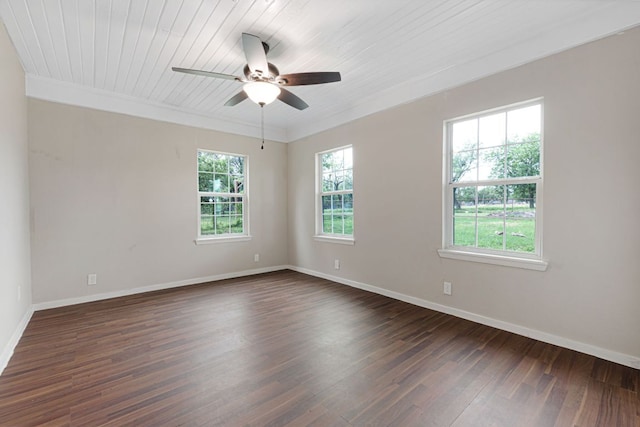 1414 E 4th St, Lampasas, TX 76550 - empty room with dark wood finished floors, a ceiling fan, and ornamental molding