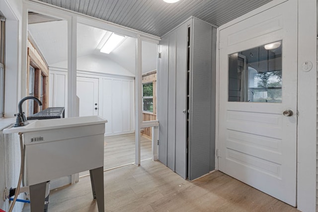 1414 E 4th St, Lampasas, TX 76550 - corridor with light wood finished floors and vaulted ceiling