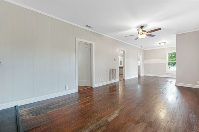 1414 E 4th St, Lampasas, TX 76550 - unfurnished living room with ceiling fan, dark wood-type flooring, and crown molding