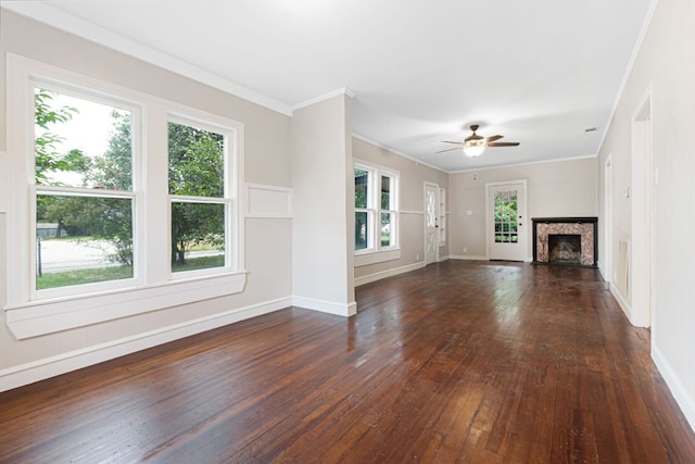 1414 E 4th St, Lampasas, TX 76550 - unfurnished living room with dark wood-type flooring, a fireplace, healthy amount of natural light, crown molding, and a ceiling fan
