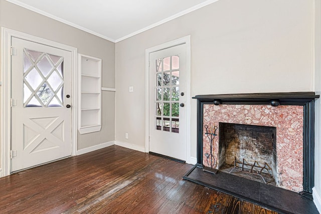 1414 E 4th St, Lampasas, TX 76550 - foyer entrance featuring dark wood-type flooring, healthy amount of natural light, crown molding, and a tile fireplace