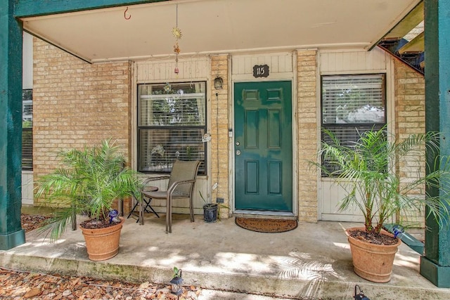 1624 Aquarena Springs Dr Unit B115, San Marcos, TX 78666 - doorway to property featuring brick siding and a porch