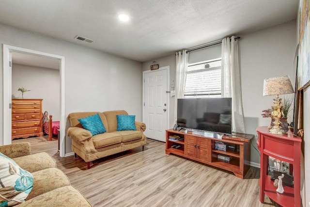1624 Aquarena Springs Dr Unit B115, San Marcos, TX 78666 - living room featuring light wood finished floors and recessed lighting