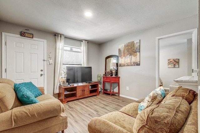 1624 Aquarena Springs Dr Unit B115, San Marcos, TX 78666 - living area with light wood-type flooring and baseboards