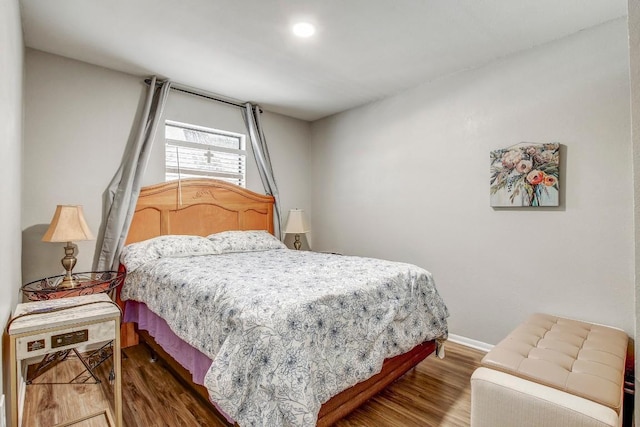 1624 Aquarena Springs Dr Unit B115, San Marcos, TX 78666 - bedroom featuring wood finished floors and baseboards