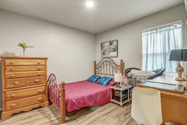 1624 Aquarena Springs Dr Unit B115, San Marcos, TX 78666 - bedroom featuring light wood-style flooring and multiple windows