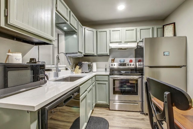 1624 Aquarena Springs Dr Unit B115, San Marcos, TX 78666 - kitchen featuring black appliances, under cabinet range hood, light countertops, and light wood-type flooring