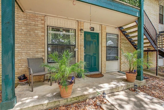 1624 Aquarena Springs Dr Unit B115, San Marcos, TX 78666 - view of exterior entry with brick siding and covered porch