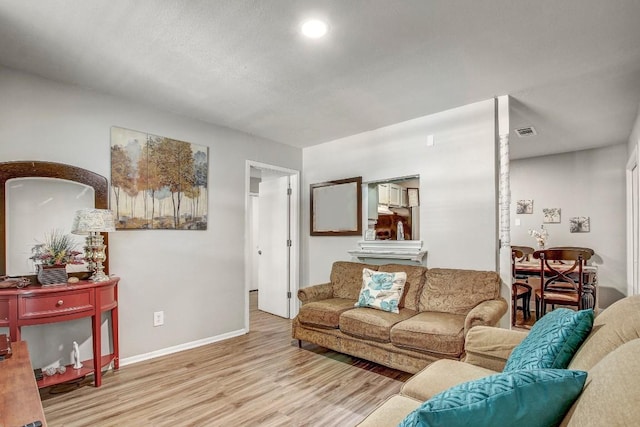 1624 Aquarena Springs Dr Unit B115, San Marcos, TX 78666 - living room with wood finished floors and baseboards