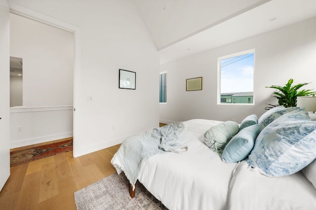 1703 Miami Dr, Austin, TX 78733 - bedroom with light wood-style flooring and vaulted ceiling