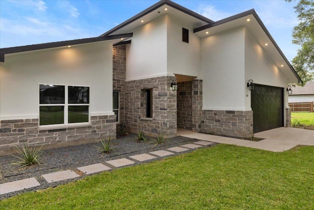 108 Bill St, Elgin, TX 78621 - view of front of house with stone siding, stucco siding, concrete driveway, and a front yard