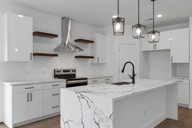 108 Bill St, Elgin, TX 78621 - kitchen featuring open shelves, stainless steel electric range, wall chimney range hood, white cabinets, and light wood-style floors