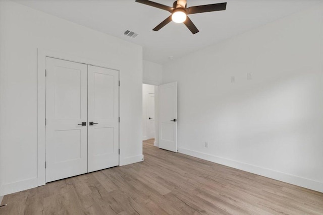 108 Bill St, Elgin, TX 78621 - unfurnished bedroom featuring light wood-style floors, a closet, and ceiling fan
