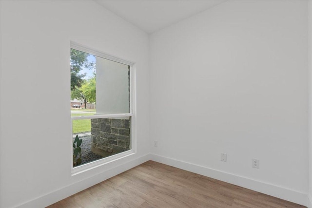 108 Bill St, Elgin, TX 78621 - spare room featuring baseboards and wood finished floors