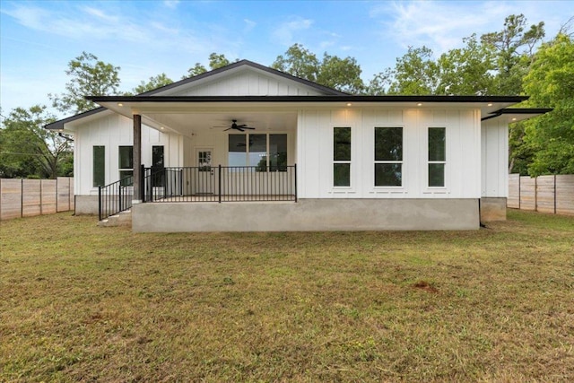 108 Bill St, Elgin, TX 78621 - rear view of property with ceiling fan, a fenced backyard, and board and batten siding