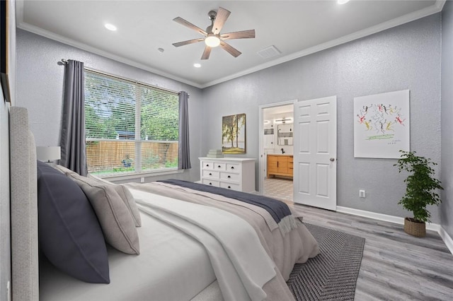 8721 Little Laura Dr, Austin, TX 78757 - bedroom with ornamental molding, a textured wall, light wood-style flooring, connected bathroom, and recessed lighting