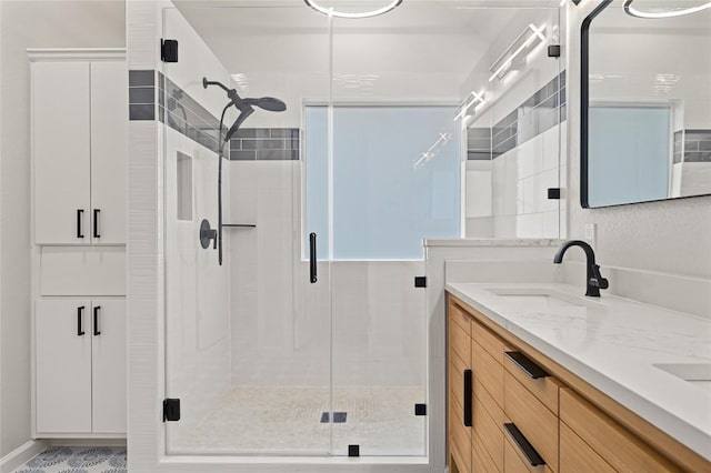 8721 Little Laura Dr, Austin, TX 78757 - bathroom with a stall shower and double vanity