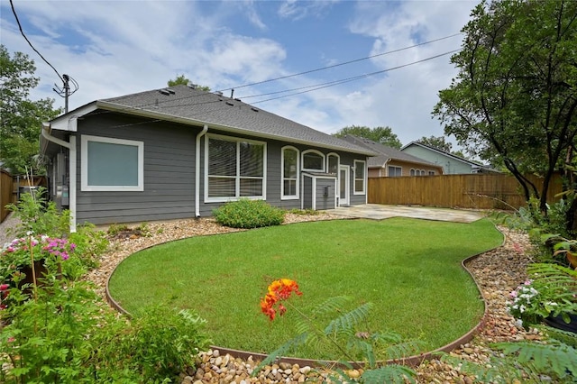8721 Little Laura Dr, Austin, TX 78757 - back of property featuring a patio and roof with shingles