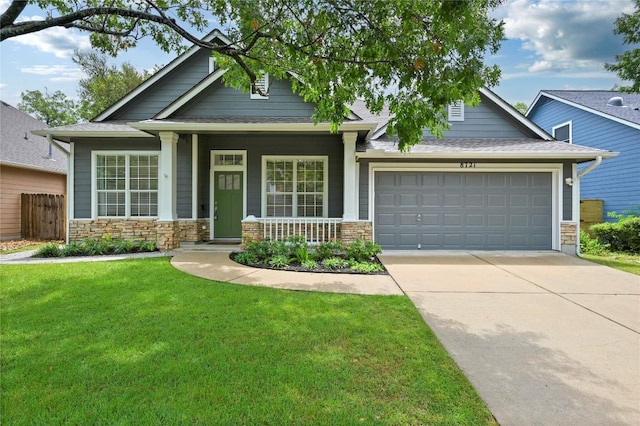 8721 Little Laura Dr, Austin, TX 78757 - craftsman-style home featuring concrete driveway, a garage, covered porch, stone siding, and a shingled roof
