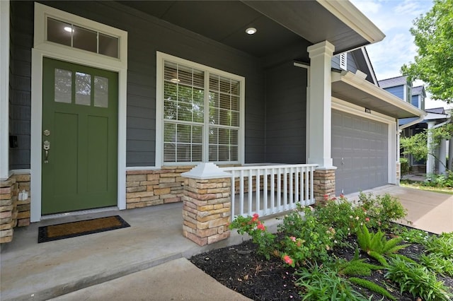 8721 Little Laura Dr, Austin, TX 78757 - property entrance featuring a porch, stone siding, and driveway