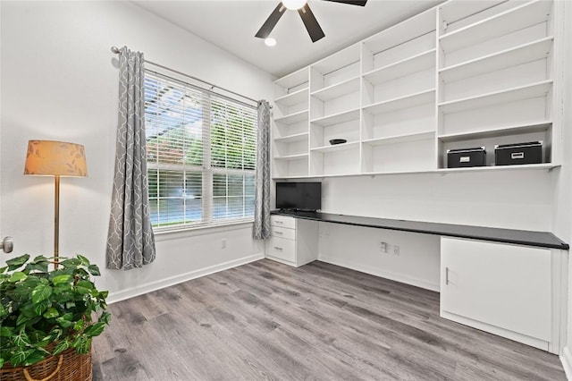 8721 Little Laura Dr, Austin, TX 78757 - unfurnished office featuring built in study area, plenty of natural light, ceiling fan, and wood finished floors