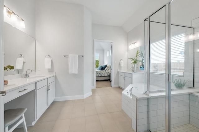 913 Landing Ln, Leander, TX 78641 - ensuite bathroom featuring vanity, a bath, a shower stall, and tile patterned floors