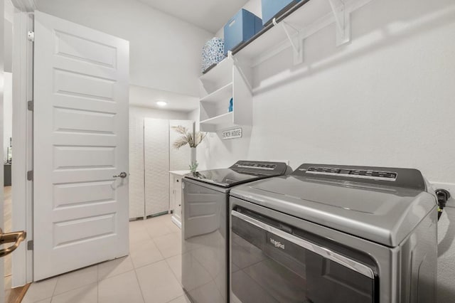 913 Landing Ln, Leander, TX 78641 - washroom with independent washer and dryer and light tile patterned flooring