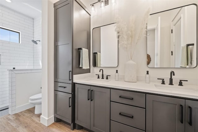 4100 Peak Look Out Dr, Austin, TX 78738 - full bath featuring double vanity, wood finished floors, and a tile shower