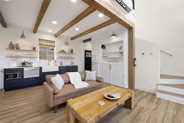 4100 Peak Look Out Dr, Austin, TX 78738 - living area featuring light wood-style floors, recessed lighting, beam ceiling, and stairs