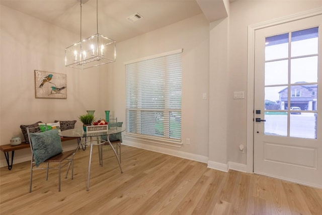 103 Periwinkle Ln, Bastrop, TX 78602 - dining space featuring a chandelier and wood finished floors