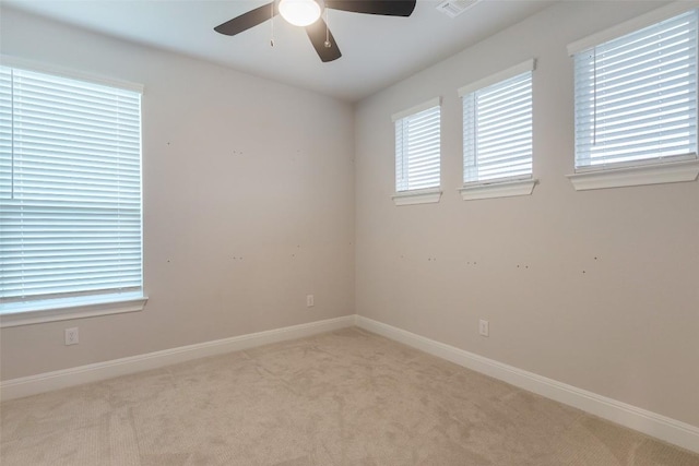 103 Periwinkle Ln, Bastrop, TX 78602 - carpeted empty room featuring ceiling fan and plenty of natural light