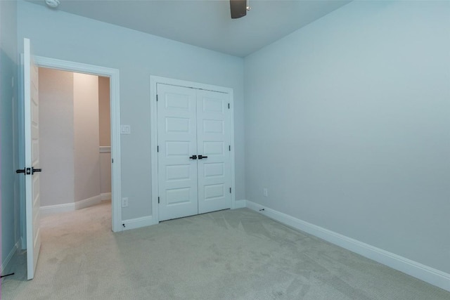 103 Periwinkle Ln, Bastrop, TX 78602 - unfurnished bedroom with carpet floors, a closet, and ceiling fan