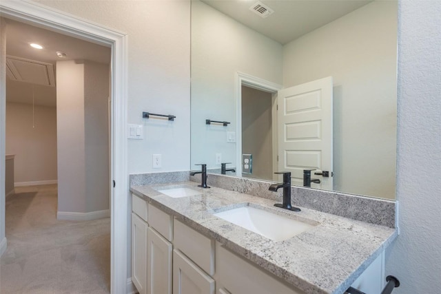103 Periwinkle Ln, Bastrop, TX 78602 - full bath with double vanity and baseboards