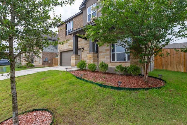 103 Periwinkle Ln, Bastrop, TX 78602 - view of front facade featuring concrete driveway, stone siding, and a garage